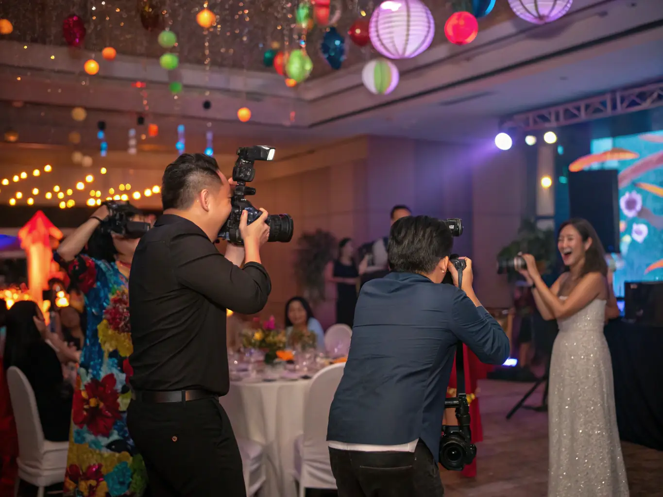 Photographers and videographers capturing moments at a lively celebration, ensuring every memory is preserved.