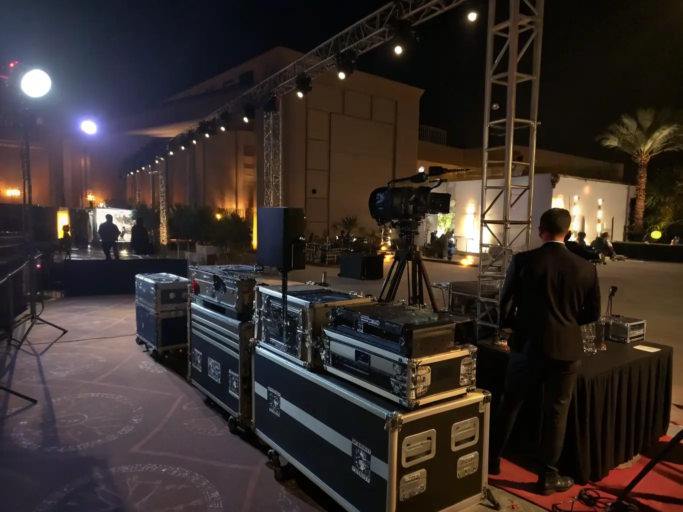 A variety of professional lighting and sound equipment set up at an event venue, ready to create the perfect ambiance.