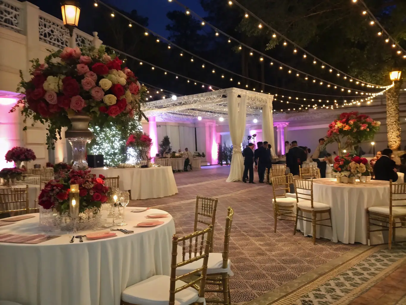A beautifully decorated event venue with stunning floral arrangements, elegant table settings, and ambient lighting, creating a magical and inviting atmosphere.